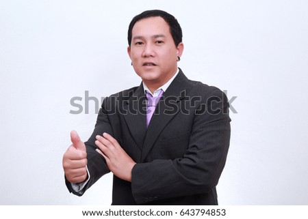 business Asia man wearing formal suit and catching something.