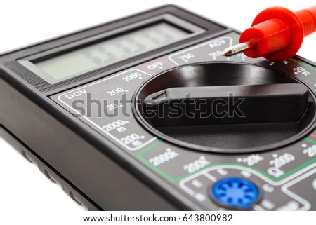 Digital multimeter with probes on a white background
