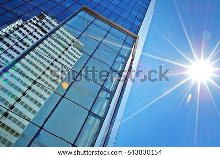 Panoramic and perspective wide angle view to steel blue background of glass high rise building skyscrapers