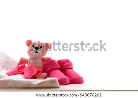 A picture of baby girl items isolated on a white background.