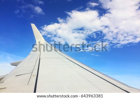The wing aircraft on the blue sky Royalty-Free Stock Photo #643963381