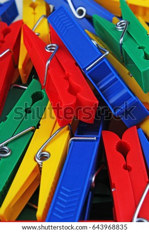 Colorful forecaps tweezers clips as background.