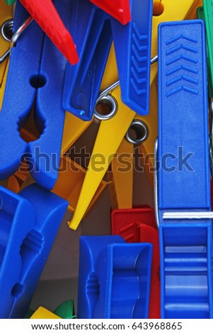 Colorful forecaps tweezers clips as background.