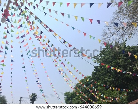 Colorful little flags hang on the wire in party celebrate.