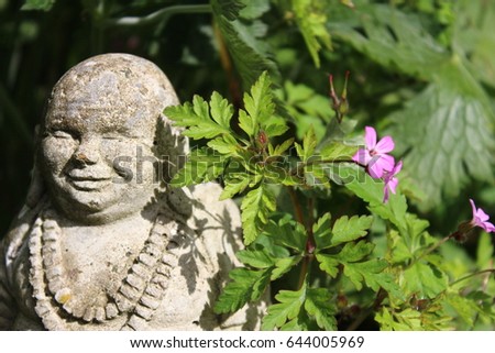 Smiling Buddha in Garden.
