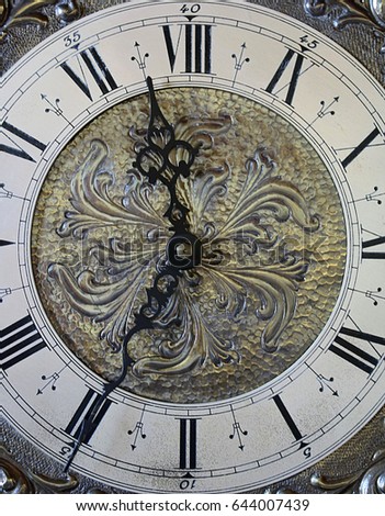 Close-up picture dial pendulum clock