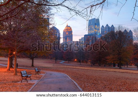 View of the Oak Hill in the Piedmont Park and Midtown Atlanta behind it in autumn twilight, USA