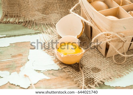 Brown eggs on an old wooden background