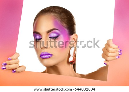 Young woman with beautiful lilac makeup on white background