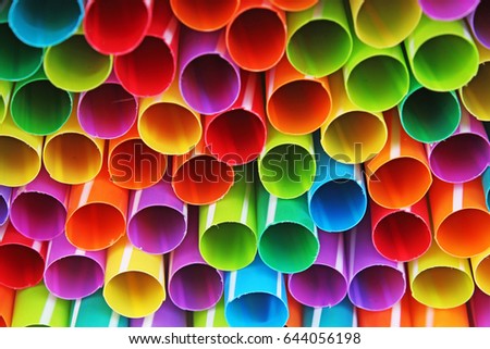 Fancy straw art background. Abstract wallpaper of colored fancy straws. Rainbow colored colorful pattern texture. Party accessories. 