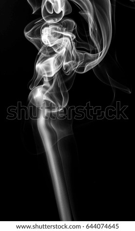 Movement of smoke,white smoke on black background.