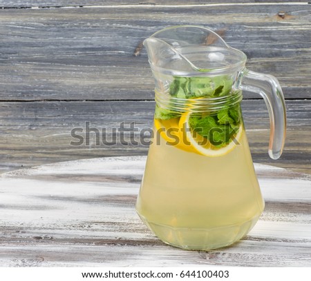 a cold refreshing drink on a wooden background