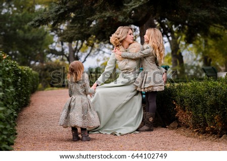 Mom and daughters outdoors