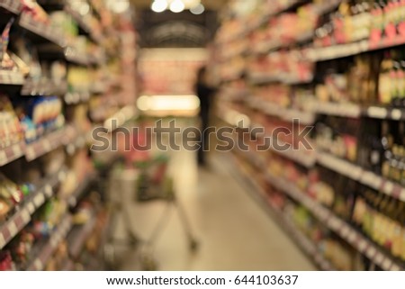 blurred image of supermarket for background usage, vintage style filter