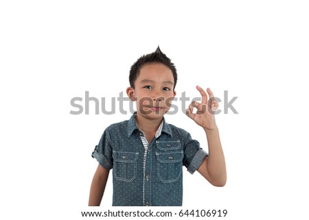 Kid making Ok sign over white background