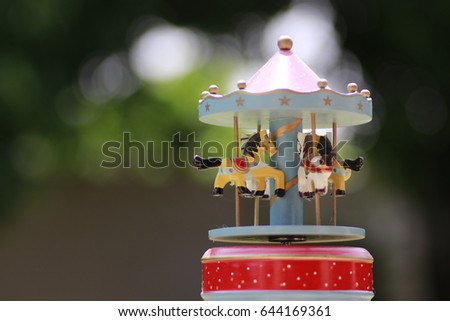 merry go round and white and green bokeh