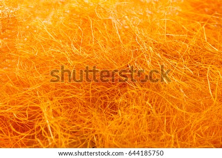 Orange wool texture. Close-up of felt, natural fabric. Bright needlework background, handmade concept
