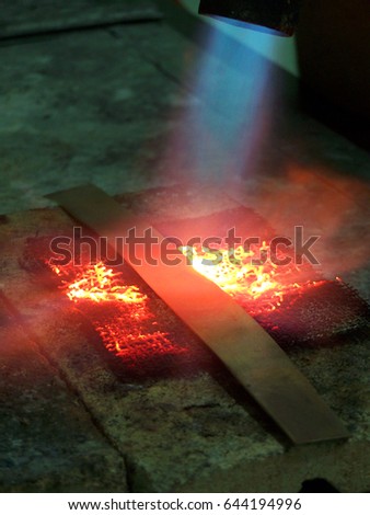 Metal smelting with blowtorch