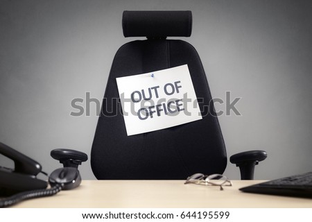 Business chair with out of office sign concept for vacation, holiday, lunch break or work life balance Royalty-Free Stock Photo #644195599
