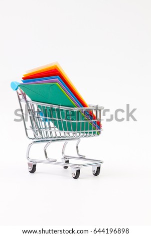 Different colored envelopes in the shopping trolley