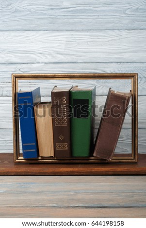 Open book, hardback colorful books on wooden table. Back to school. Copy space for text. Education business concept.Picture