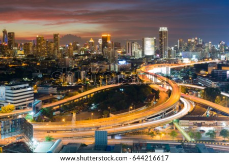 Blurred bokeh city downtown background and highway interchanged aerial view, abstract background