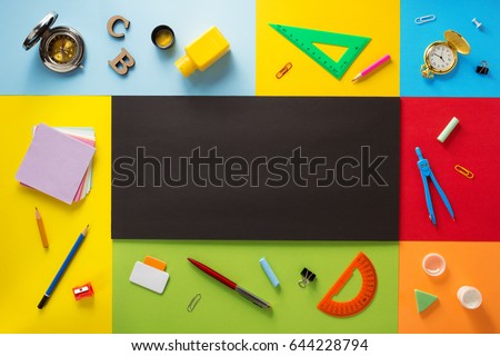 school supplies at abstract colorful background texture