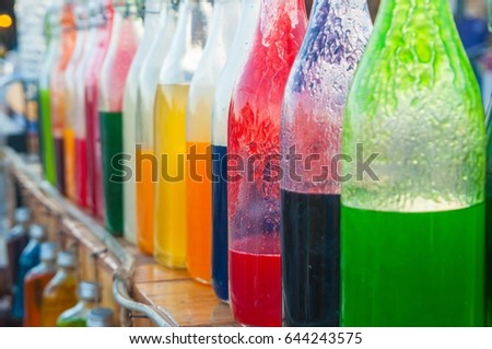 Colorful syrub in bottles for house interiors