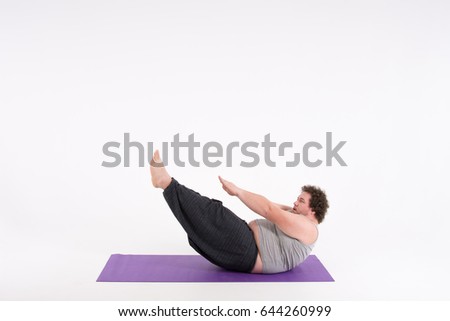 Funny fat man and yoga.
