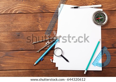 School office supplies on wooden background