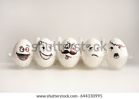 An egg with a face. Concept.the wall of eggs. army. Photo for your design