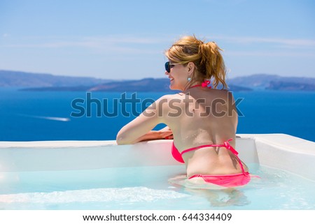 Woman relaxing in bathtub in Mediterranean