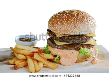 Double hamburger  fries and ketchup on a white background