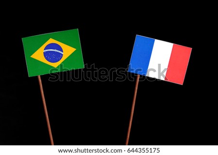 Brazilian flag with French flag isolated on black background
