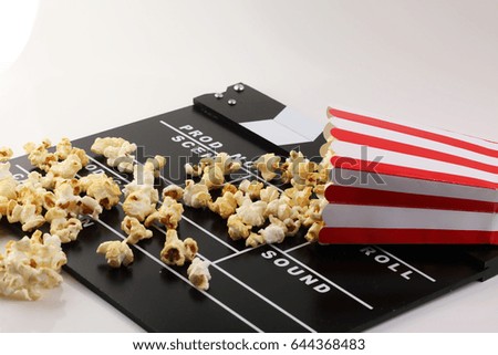 Cinema concept with popcorn and clapperboard