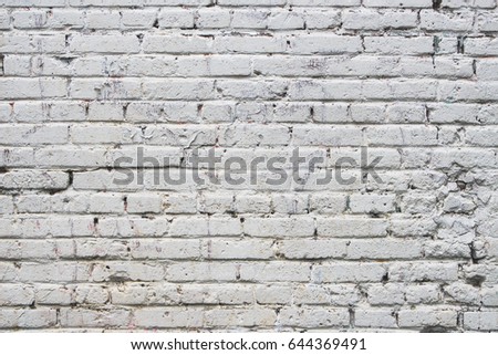 Old white brick wall. Grunge photo texture, background.