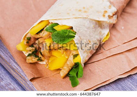 Chicken wraps with mango, basil and mint. Burrito with chicken