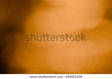 Bokeh of bright golden solar flare reflections for background