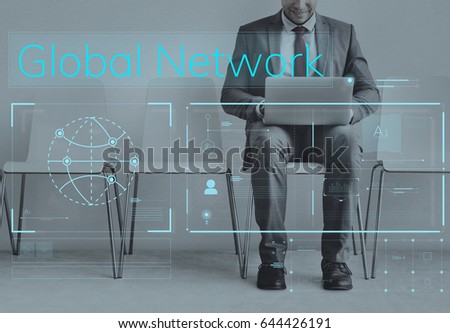 Businessman working on laptop network graphic