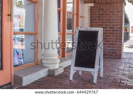 Photo Mock up of Blank Sandwich Style POP Advertising Chalkboard Sign Outside Storefront