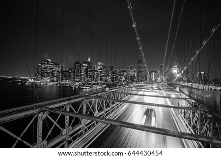Cars on Brooklyn Bridge at night