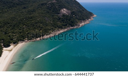 Aerial view of tropical island clear blue sea