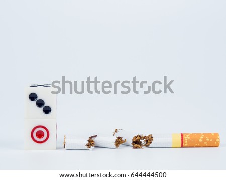 Dice 3 and 1, and Broken cigarette. World No Tobacco Day concept.
