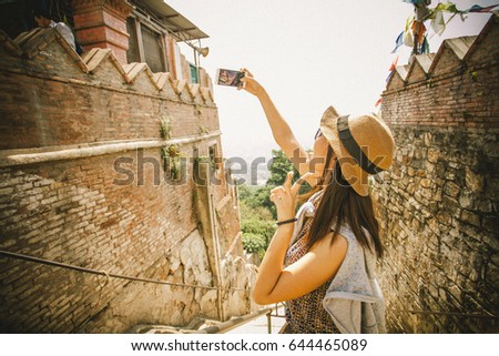 Portrait of hipster girl selfie with the ancient city in Nepal.