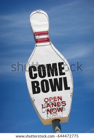 aged and worn vintage bowling pin neon sign                               