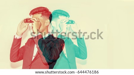 color double exposure.,Businessman observing with binoculars.,handsome man,Hipster looking to the future.,Business and finance concept,business concept Royalty-Free Stock Photo #644476186