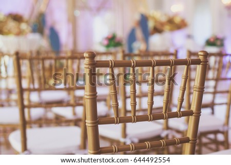 Beautiful wedding interior and table decor, flower decoration with flowers bouquet, with roses, tulips, peonies, elements of outdoor wedding ceremony
