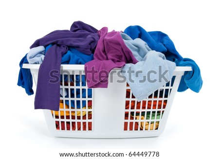 Colorful clothes in a laundry basket on white background. Blue, indigo, purple. Royalty-Free Stock Photo #64449778