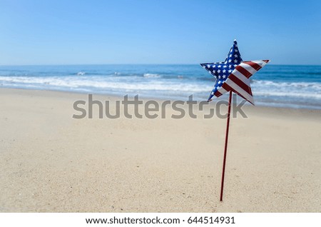 Patriotic USA background with decorations on the sandy beach
