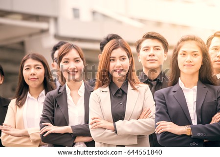 Team of Asian man and woman business people in business suit, Protrait business concept, vintage tone.
